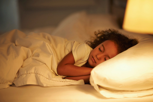 Little girl sleeping in her bed.