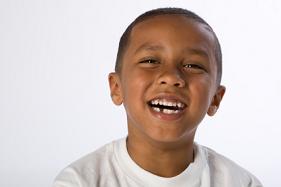 Smiling boy with missing tooth, in Arlington, WA.